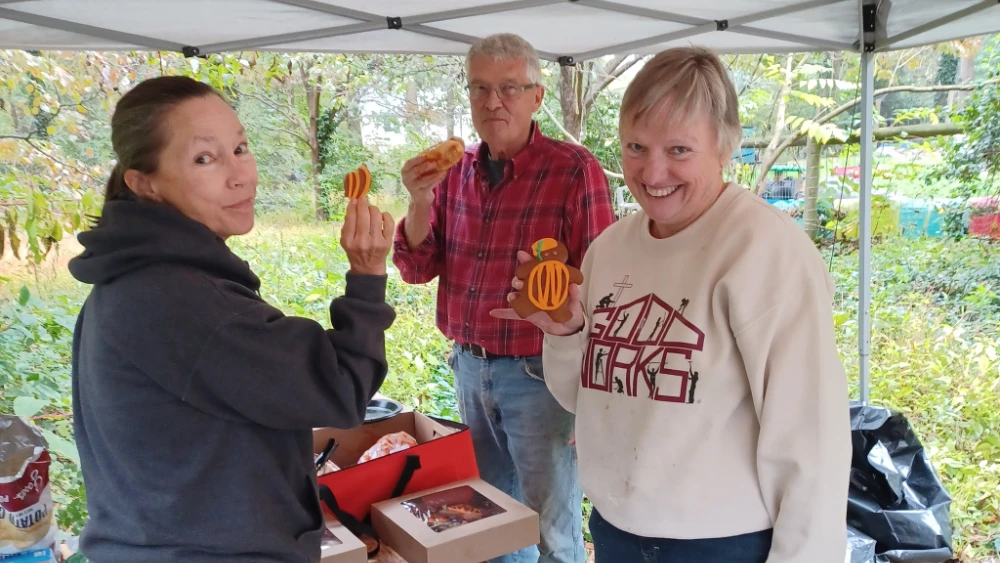 A few members of the Good Works board take a cookie break at a board retreat.