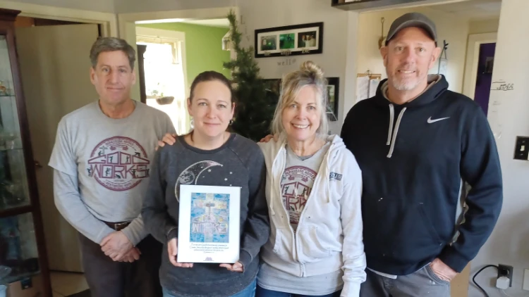 A group of Good Works volunteers with a Homeowner on the day of the project completion.