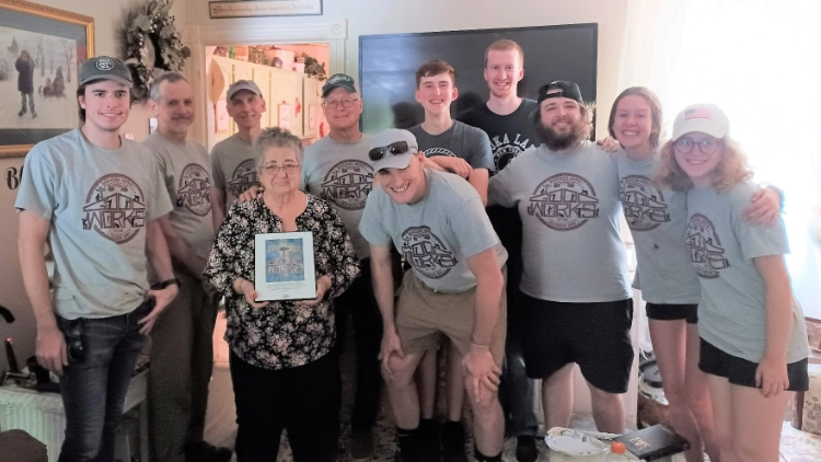 A group of Good Works volunteers with a Homeowner on the day of the project completion.
