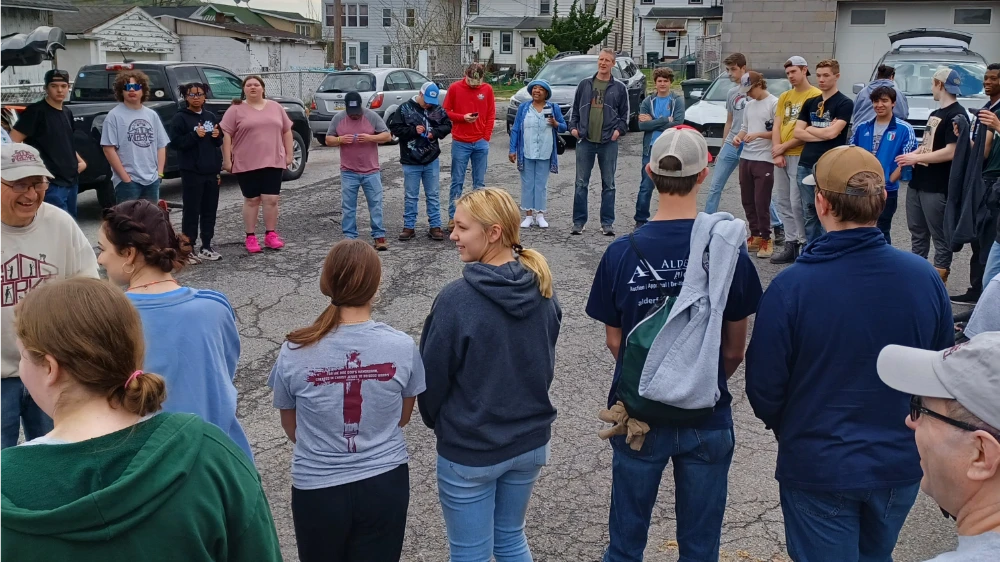 A youth group gathering for a work day, assembling at the Coatesville warehouse.